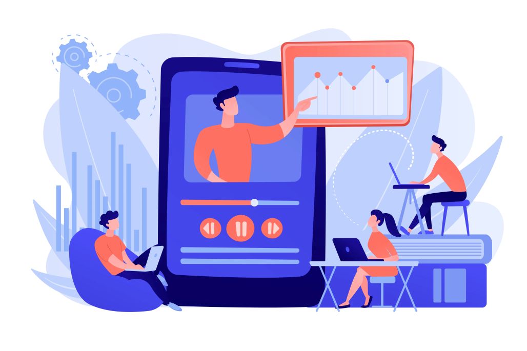 Employees engaged with laptops and phones, while a screen shows a video related to corporate training features.